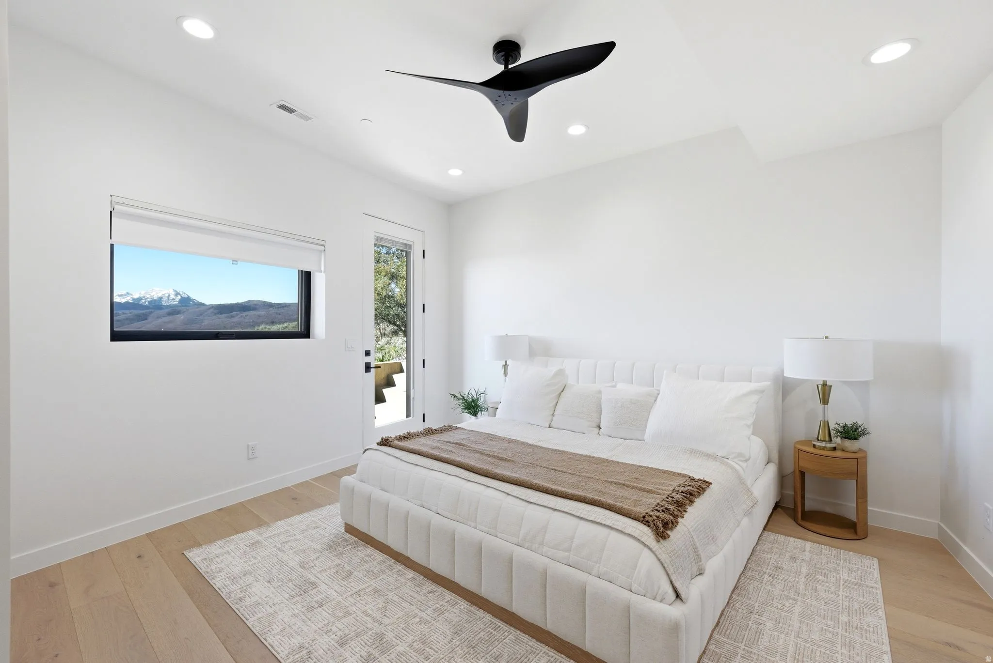 Bedroom with access to exterior, light wood-style flooring, a ceiling fan, and recessed lighting