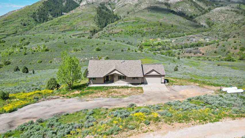 View of subject property with mountains