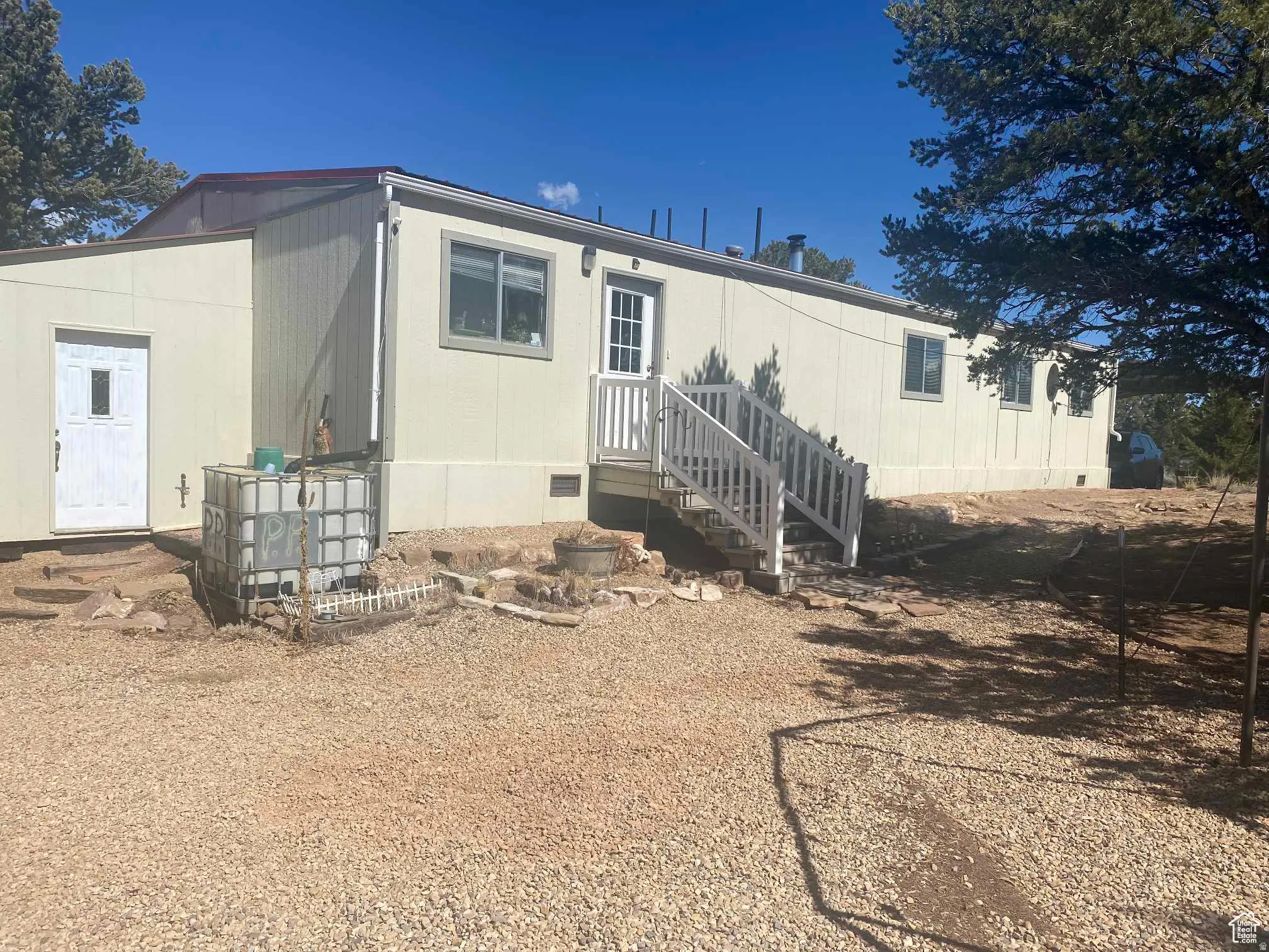 Back of house with crawl space