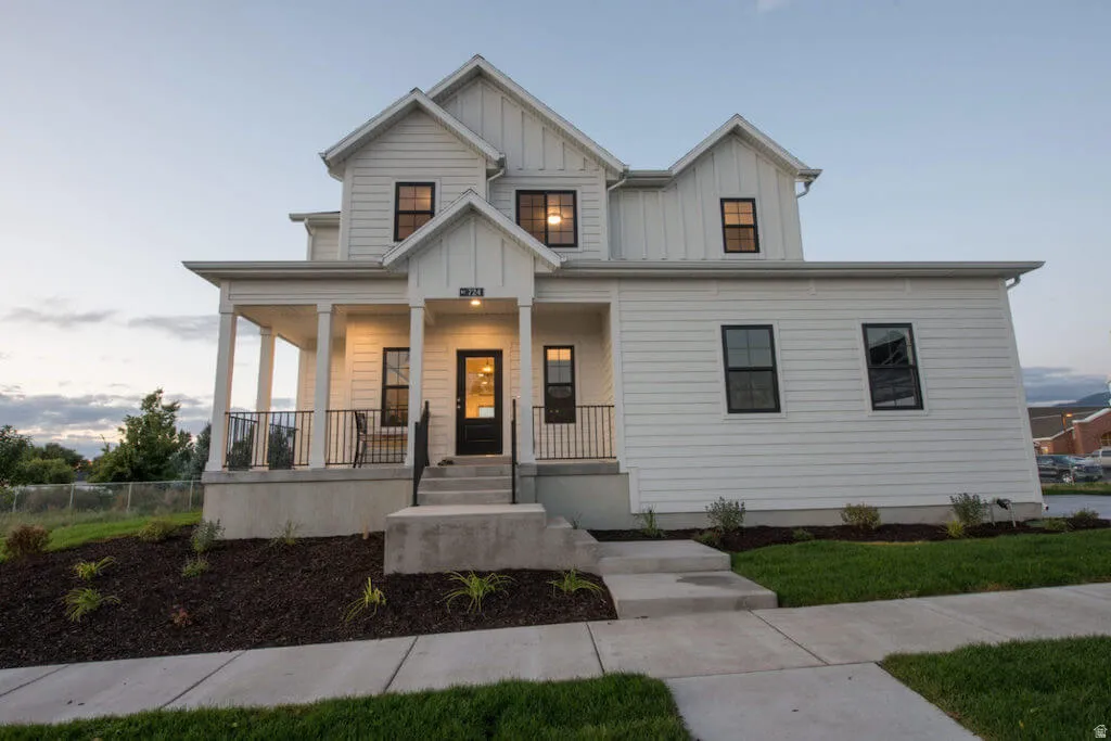 Modern farmhouse with board and batten siding and covered porch