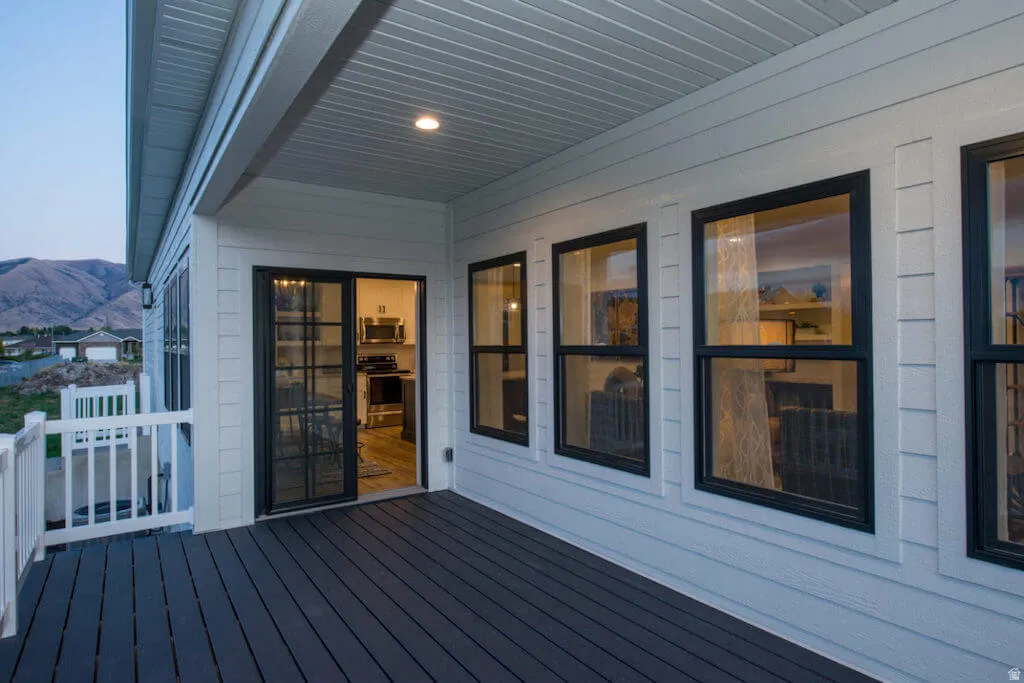 Wooden terrace featuring a mountain view