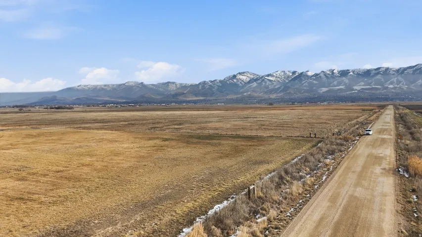 View of mountain background featuring rural landscape