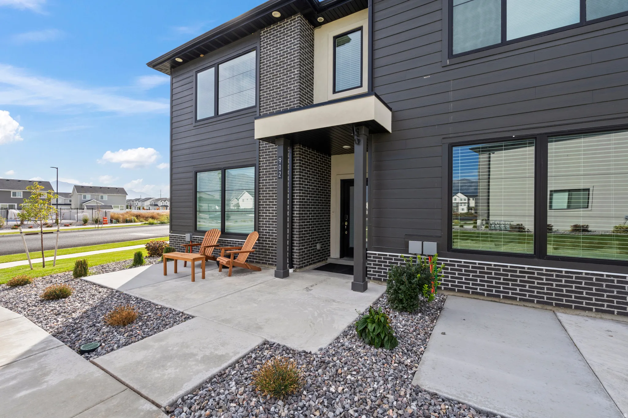 View of exterior entry with brick siding and a residential view