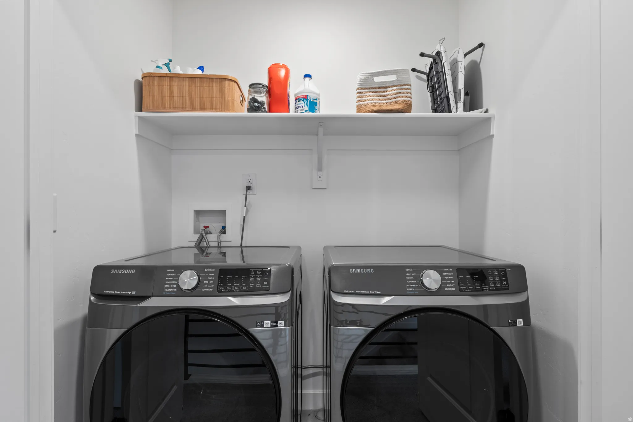 Laundry area with washer and clothes dryer