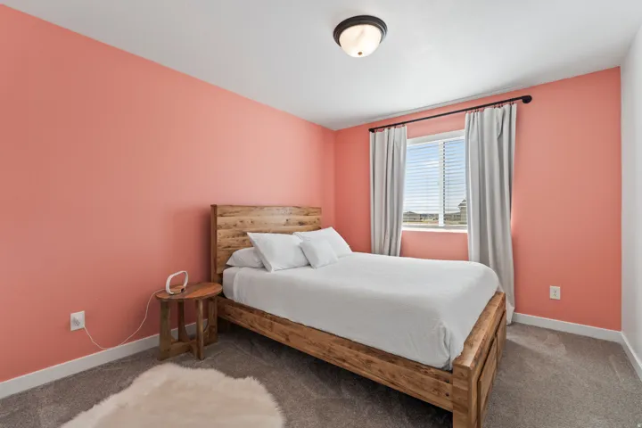Carpeted bedroom with baseboards