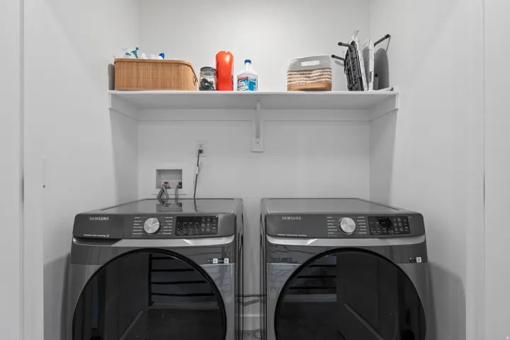 Laundry area with washer and clothes dryer