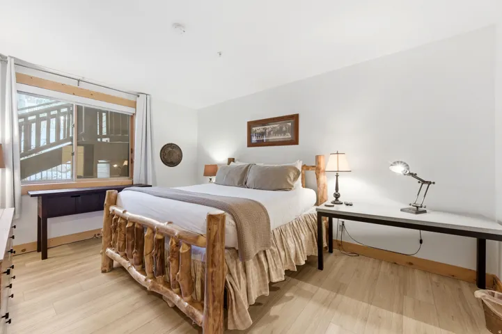 Bedroom with light wood-style floors and baseboards