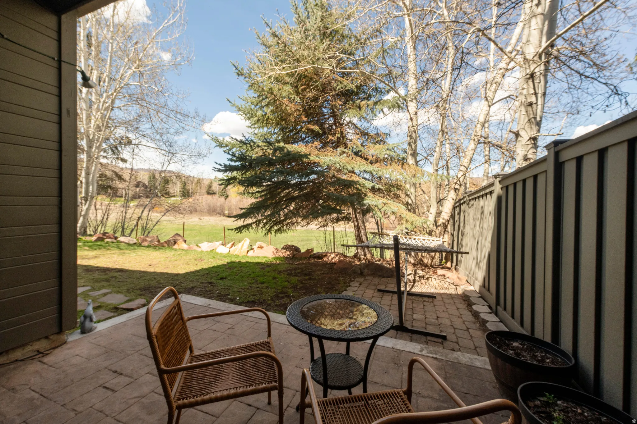 View of patio featuring an outdoor fire pit