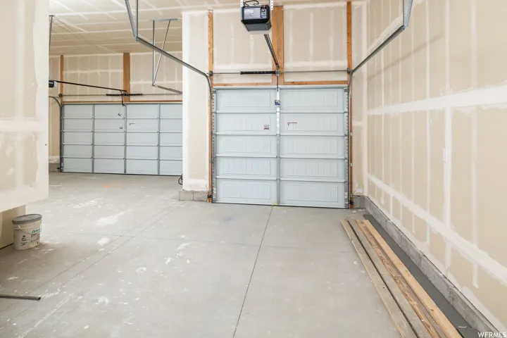 Garage featuring a garage door opener