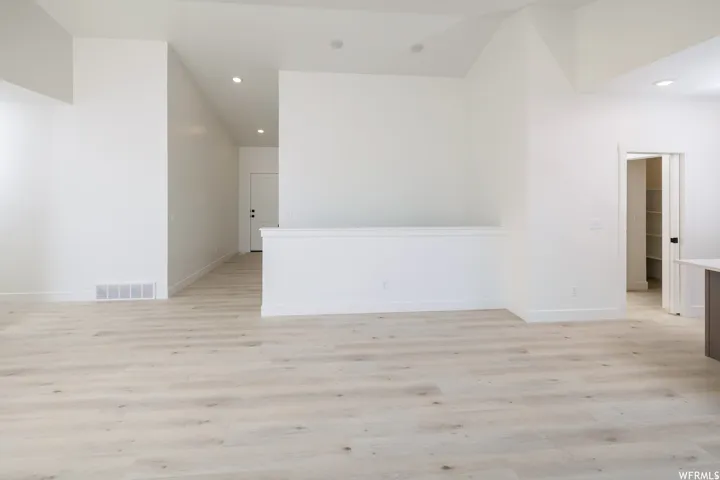 Bonus room featuring light wood finished floors and recessed lighting