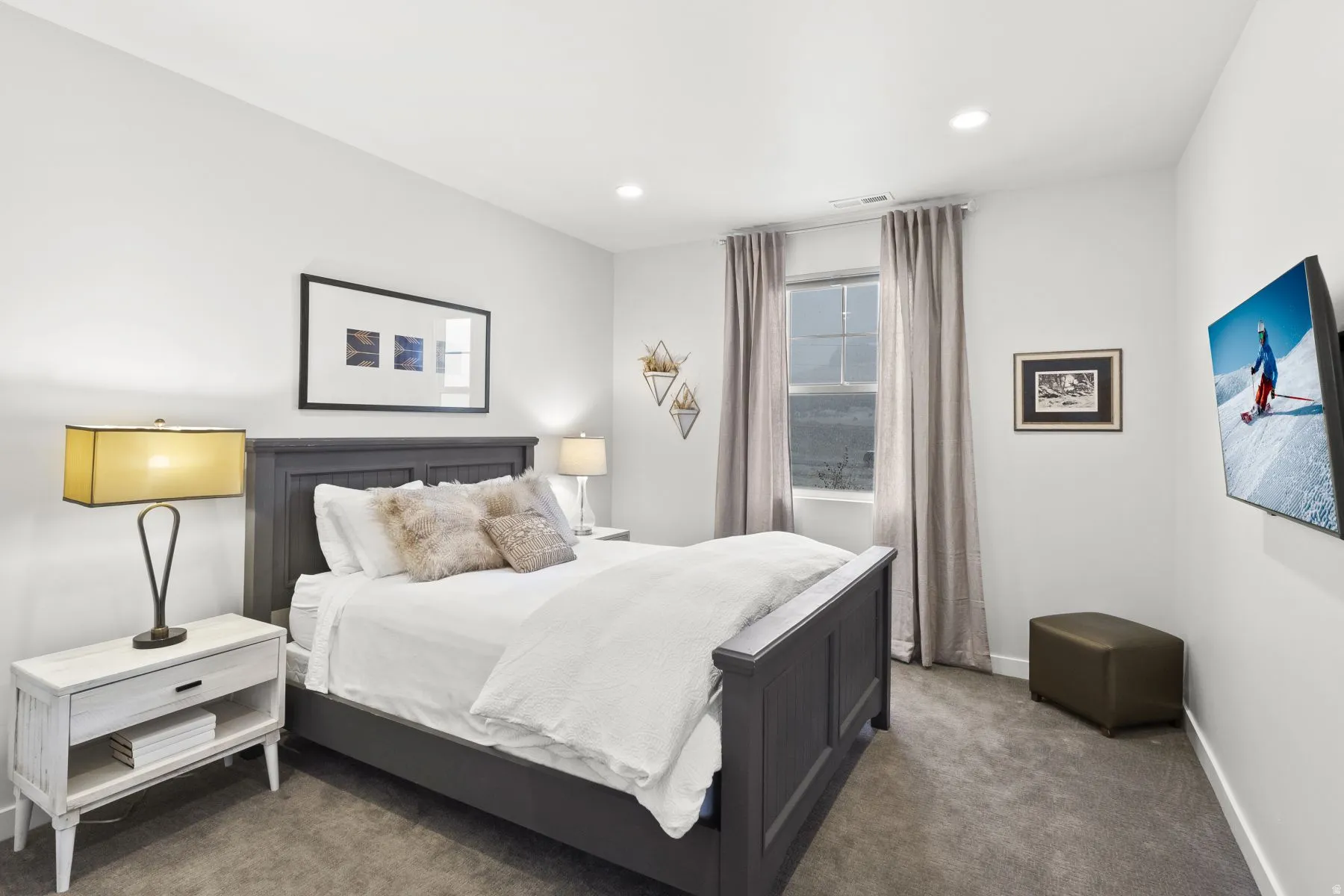Carpeted bedroom with baseboards and recessed lighting