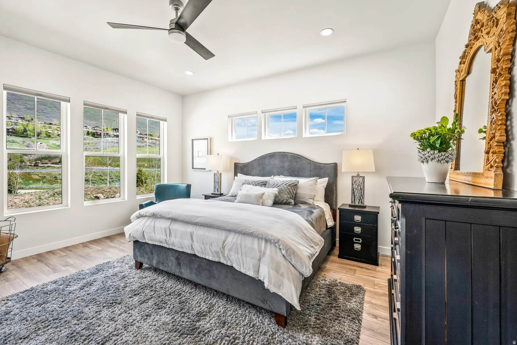 Bedroom featuring light wood finished floors, a ceiling fan, and recessed lighting