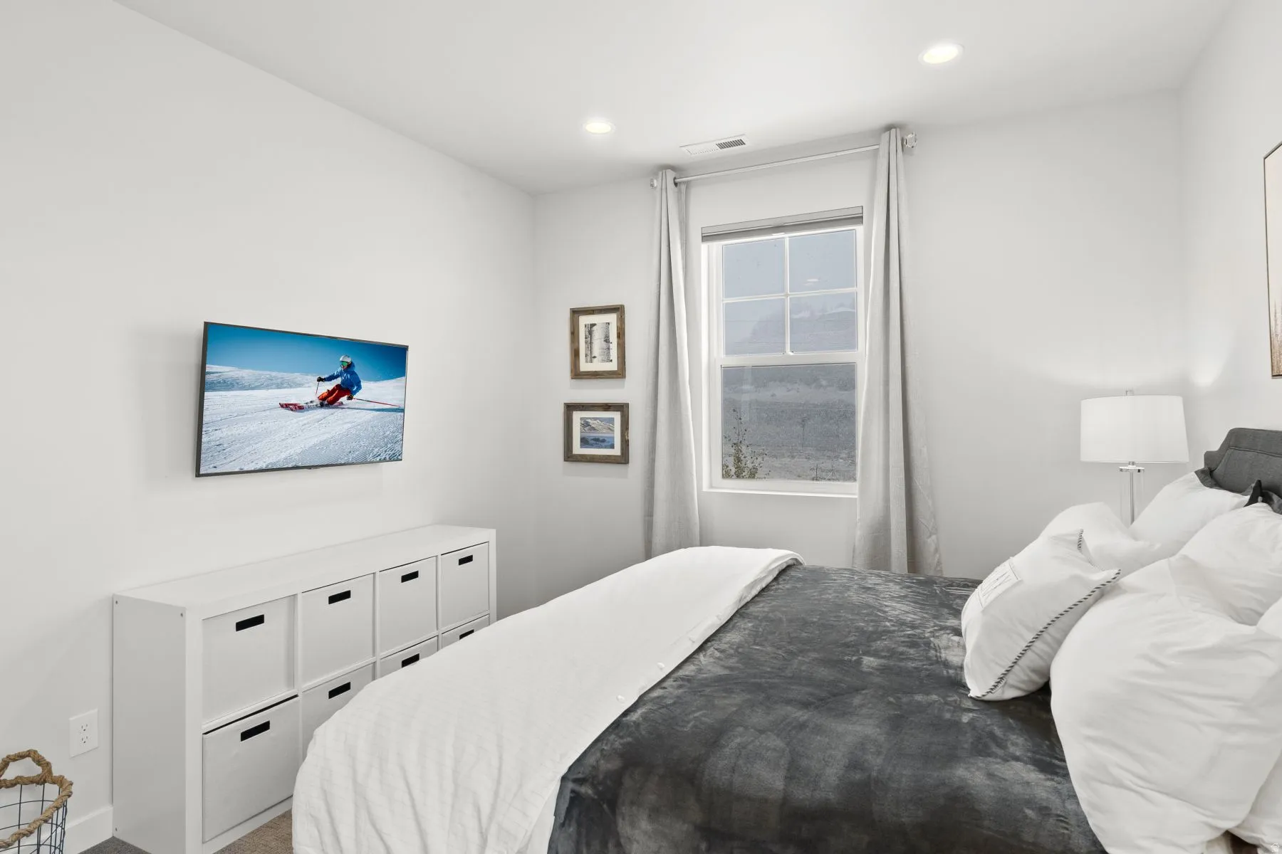 Carpeted bedroom with recessed lighting