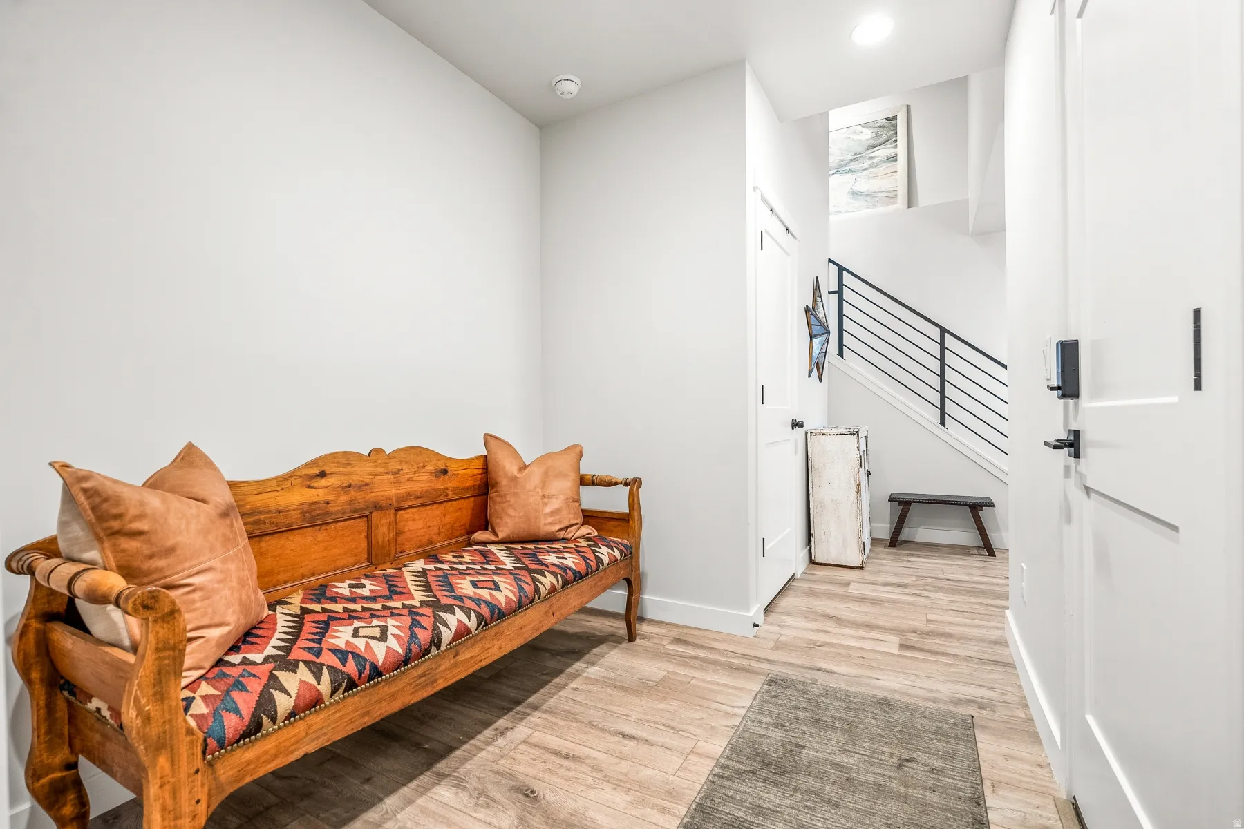 Sitting room featuring light wood-style flooring and recessed lighting