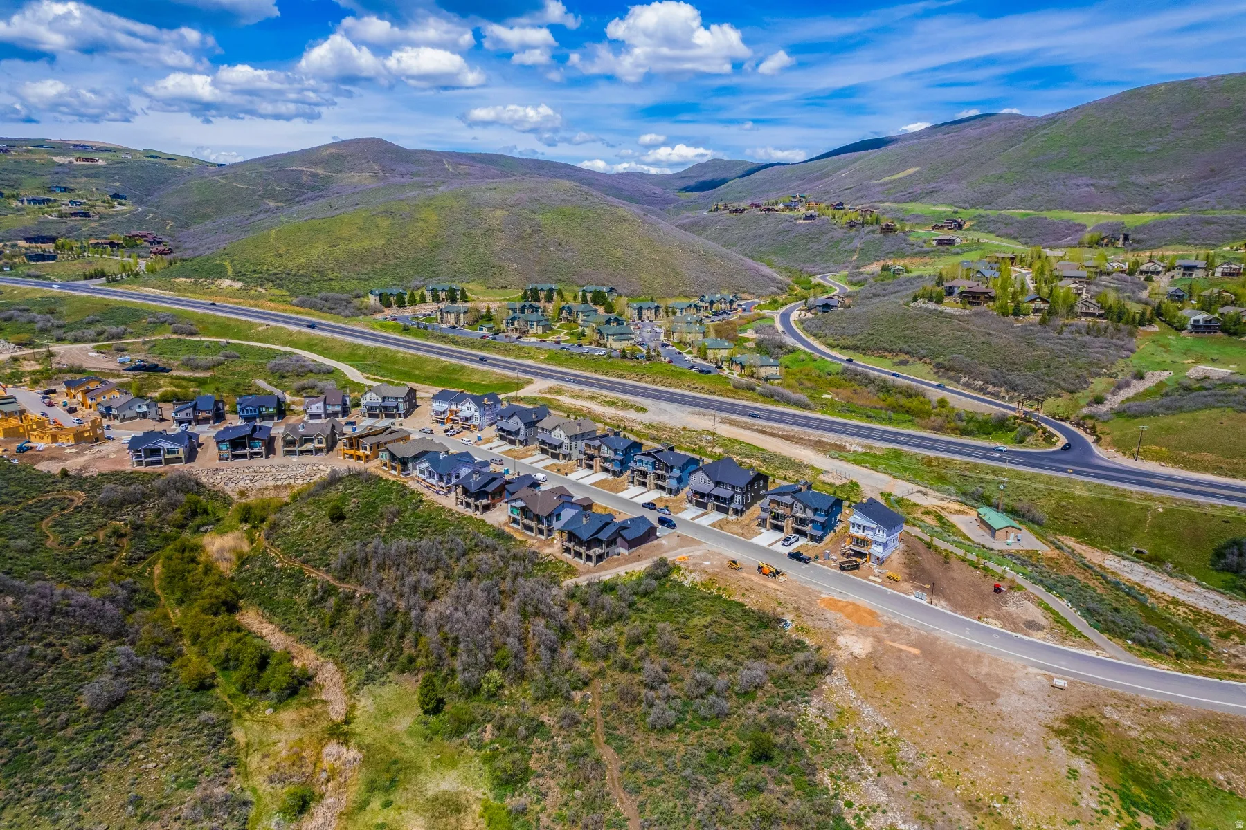 Aerial perspective of suburban area featuring a mountainous background