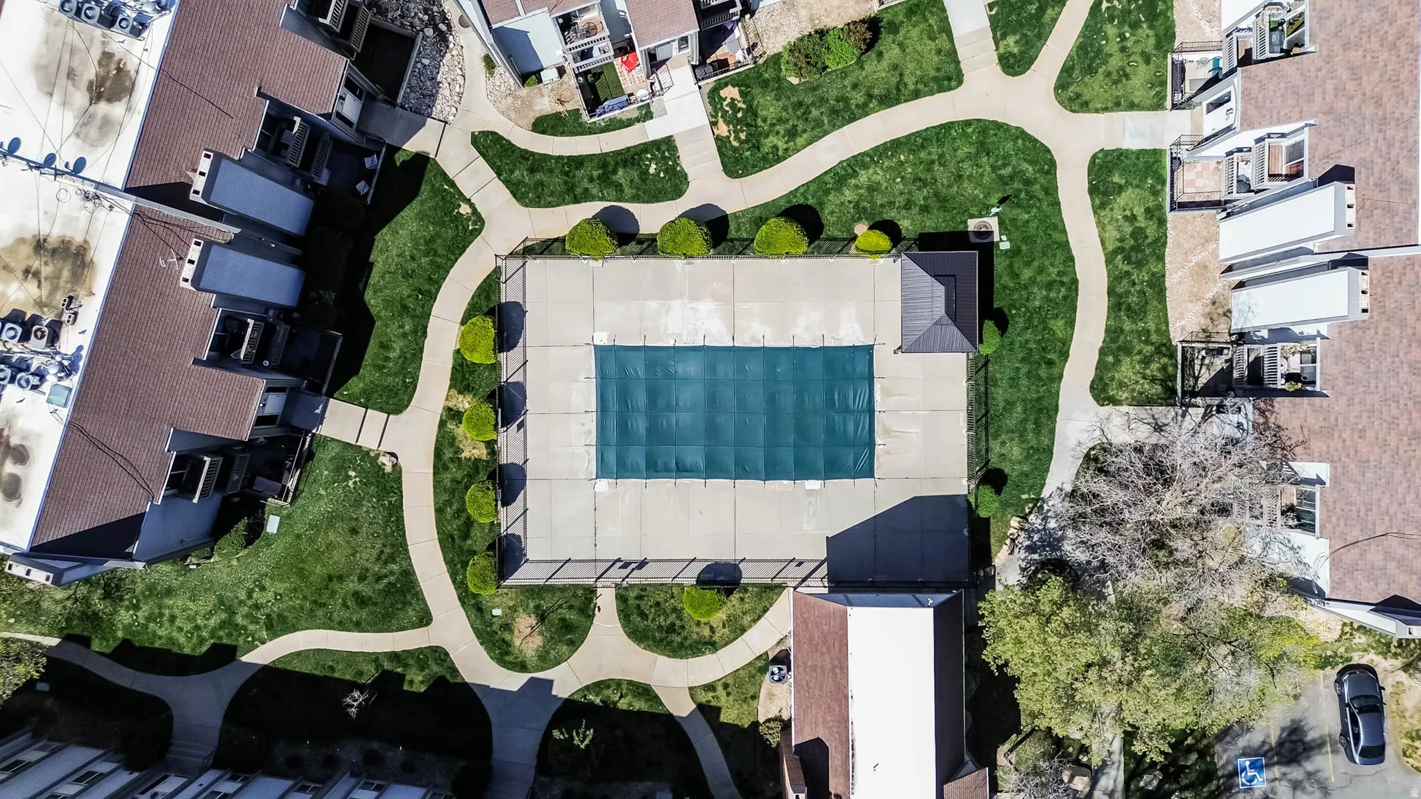 Aerial view of residential area featuring a pool area