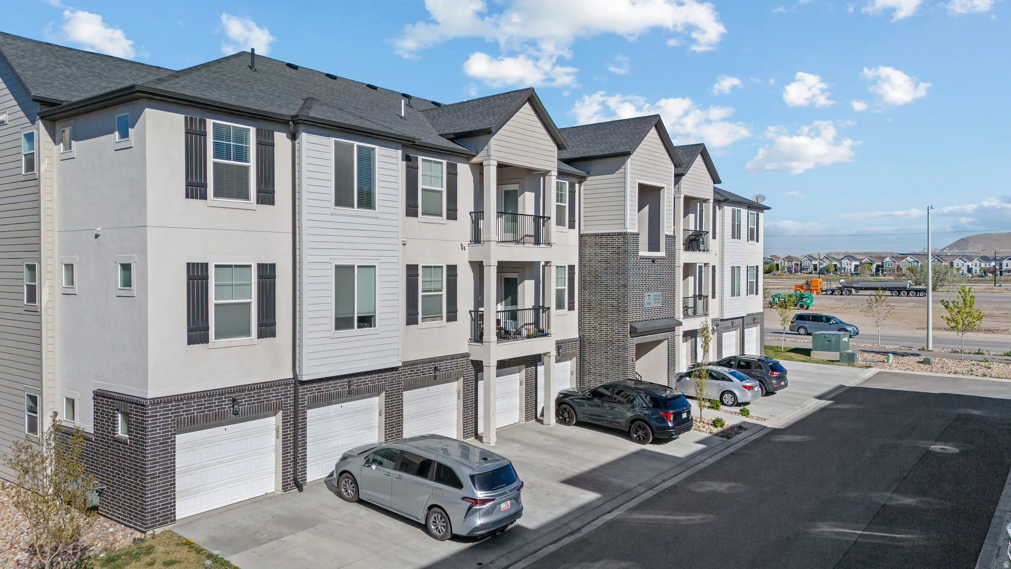 View of asphalt street featuring a residential view