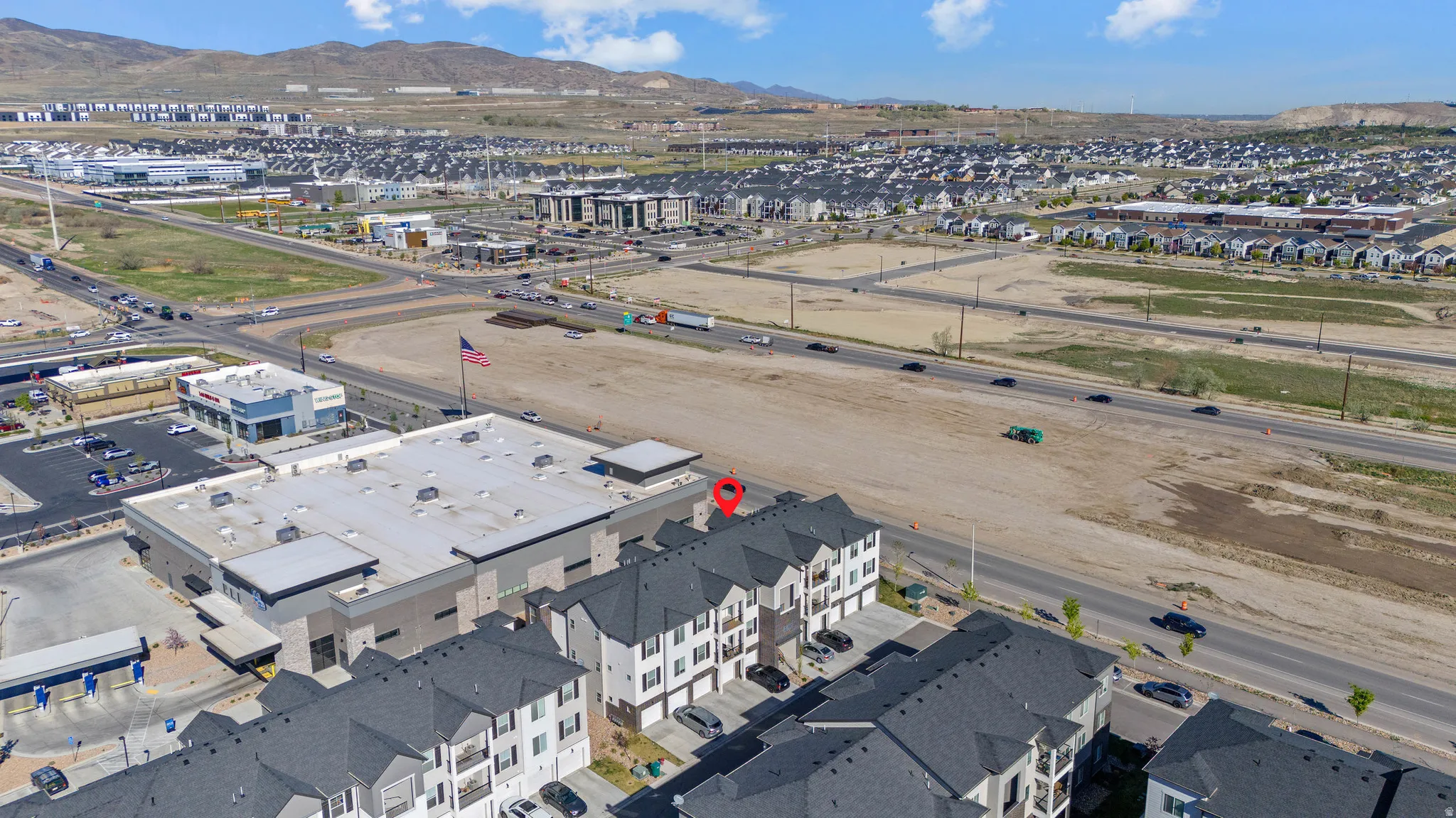 Aerial view of property and surrounding area with mountains