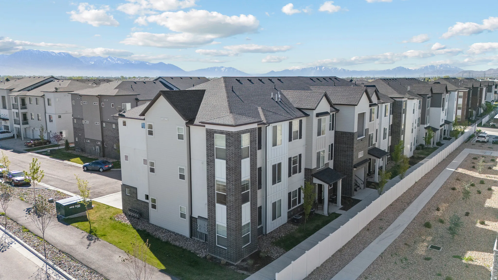 Aerial view of residential area featuring a mountainous background