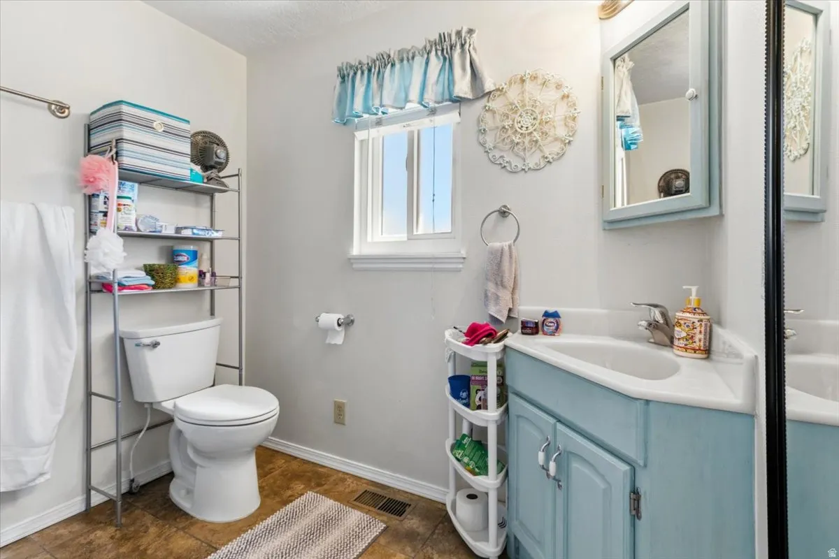 Bathroom with vanity and a shower with shower curtain