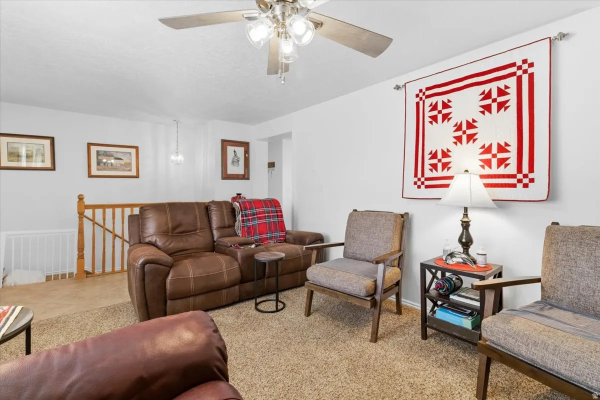 Living room featuring a ceiling fan