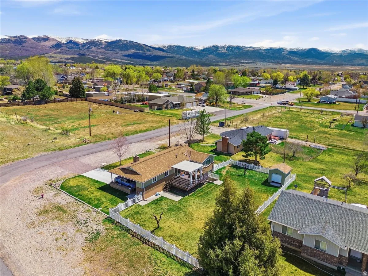 Aerial perspective of suburban area with a mountain backdrop