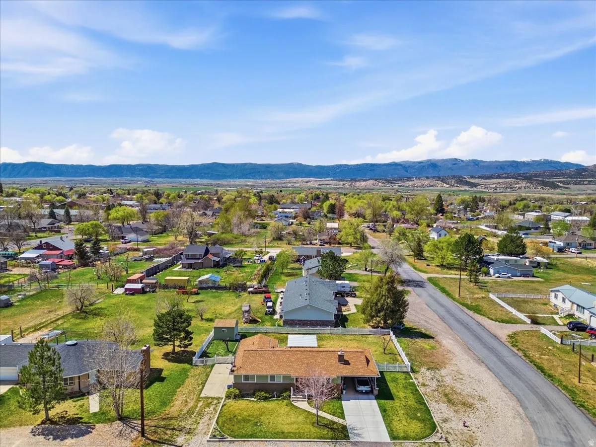 Aerial view of residential area featuring mountains