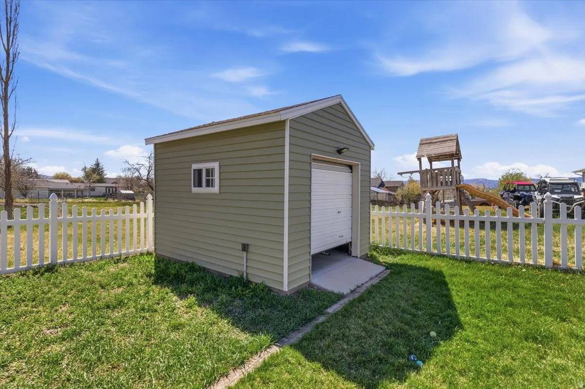 View of shed featuring a fenced backyard