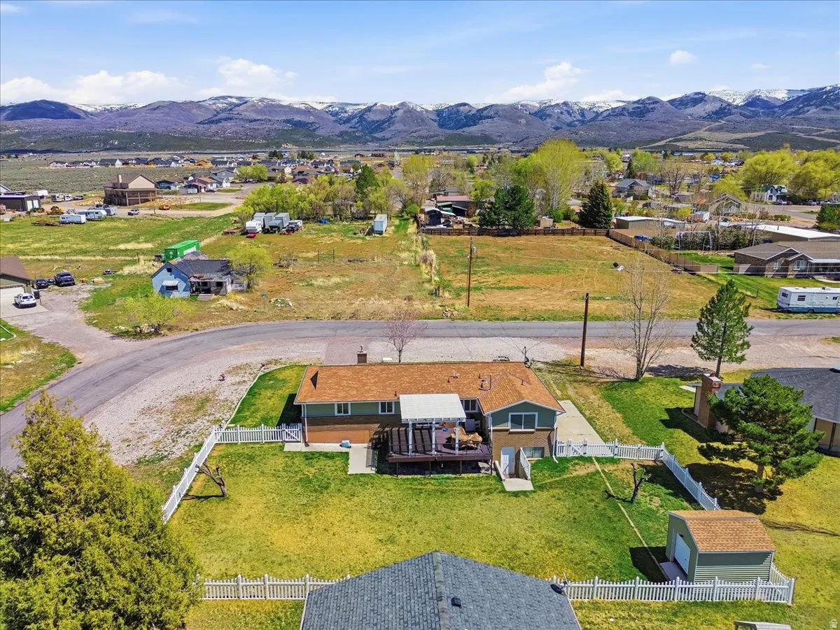 Aerial view of residential area featuring mountains