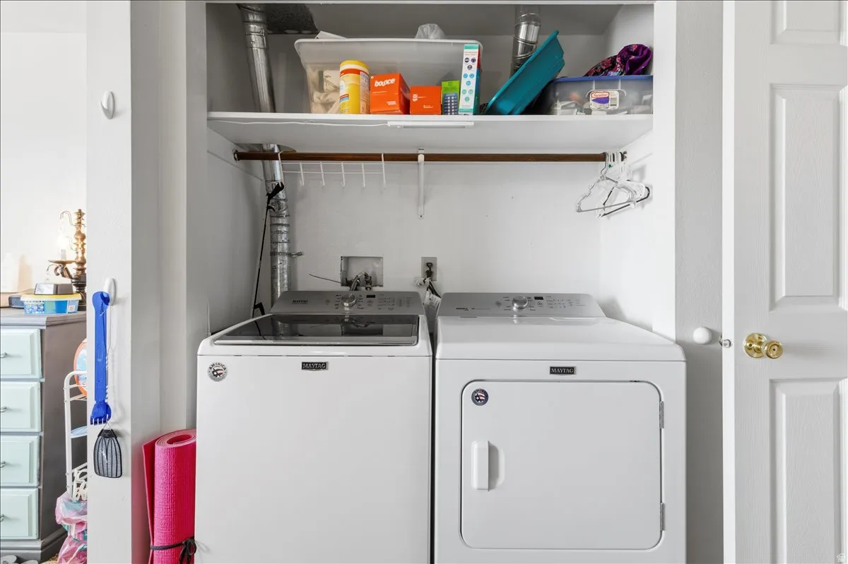 Laundry area featuring separate washer and dryer