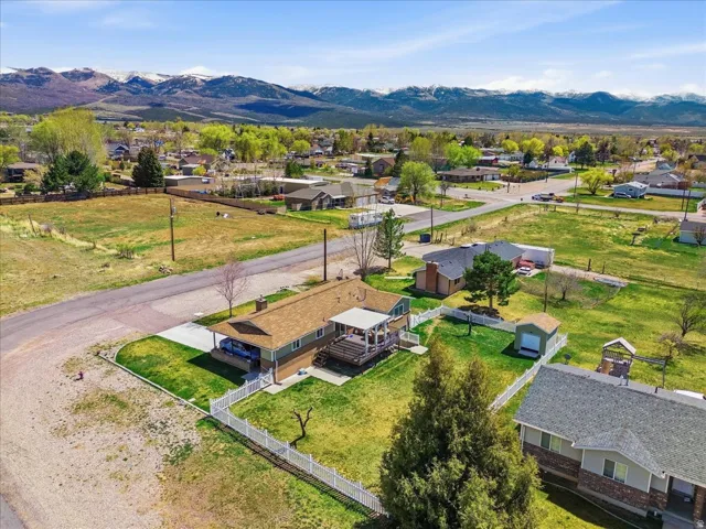 Aerial perspective of suburban area with a mountain backdrop
