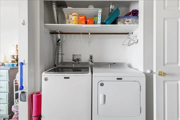 Laundry area featuring separate washer and dryer