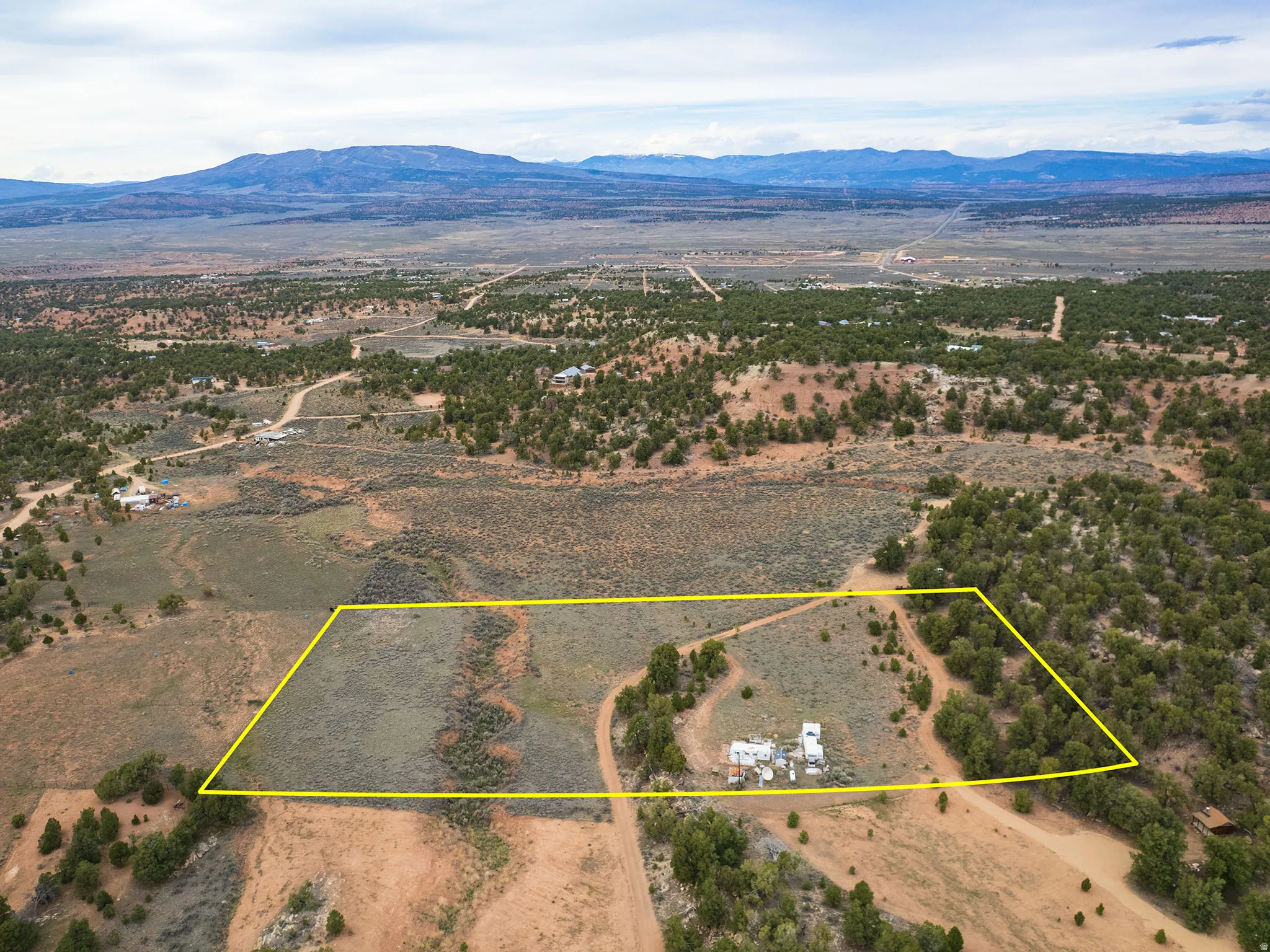 Overview of rural landscape featuring mountains and property boundaries highlighted
