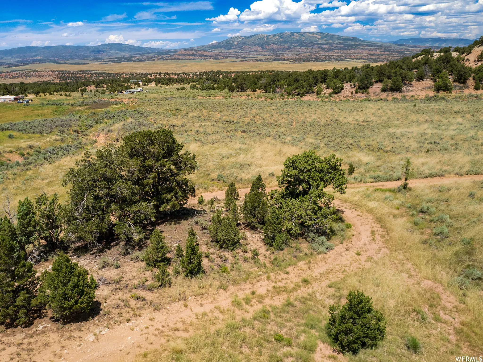 Aerial view of sparsely populated area featuring a mountainous background