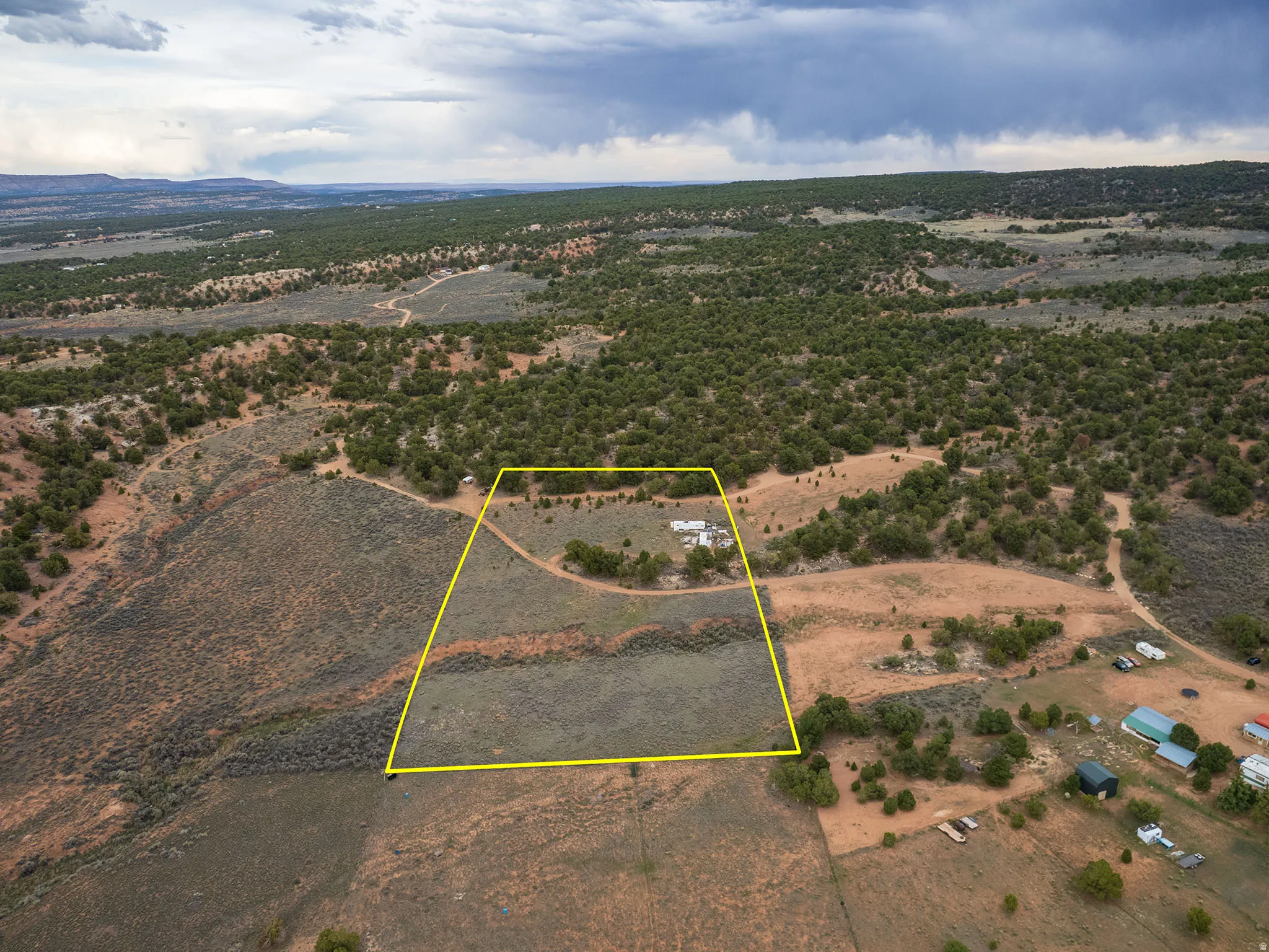 Aerial view of sparsely populated area with property boundaries highlighted