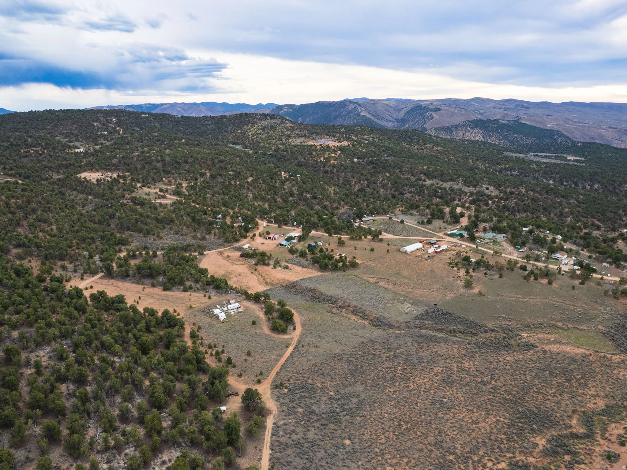 Overview of rural landscape featuring a mountainous background