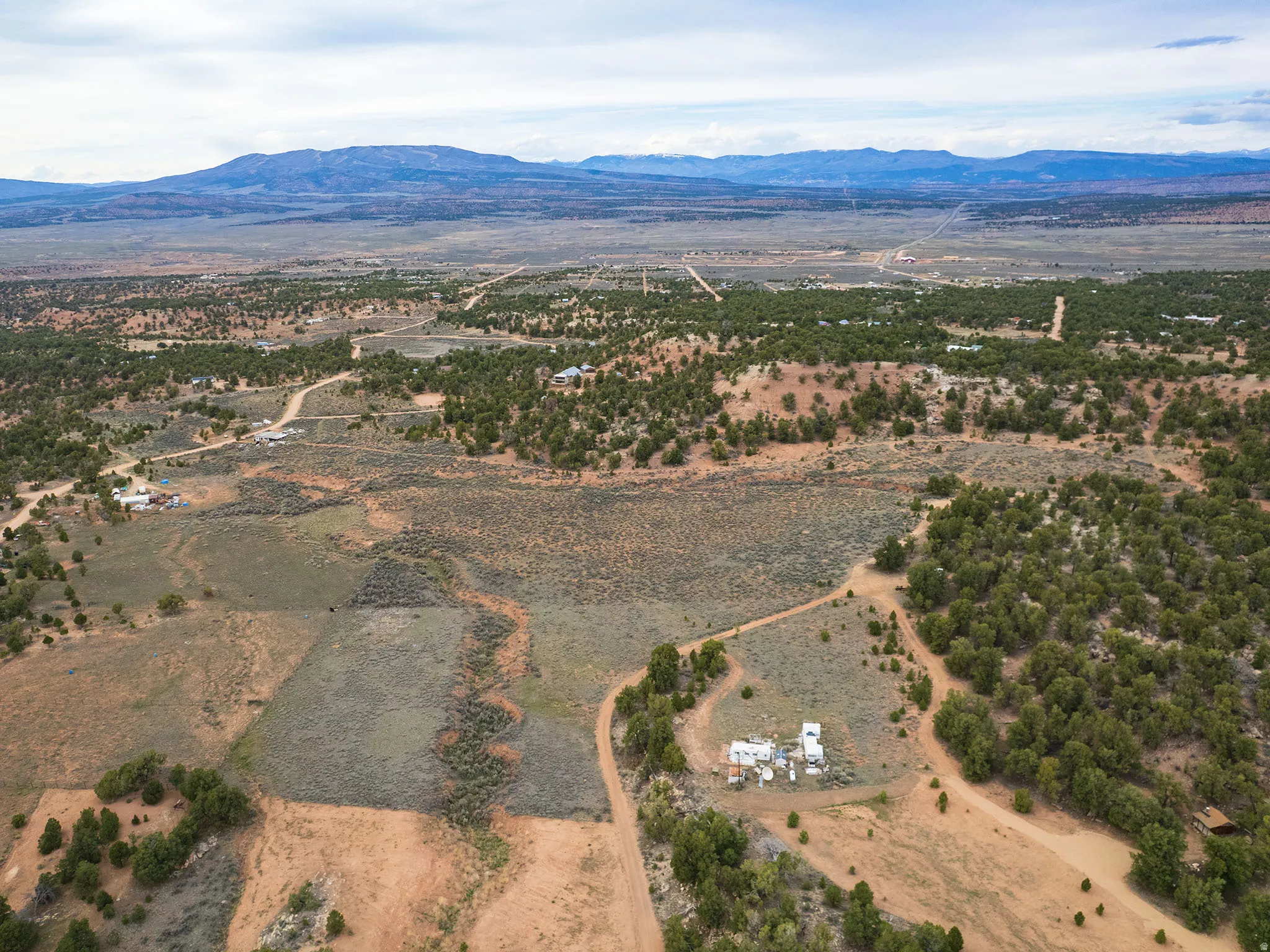 Aerial view of sparsely populated area with mountains