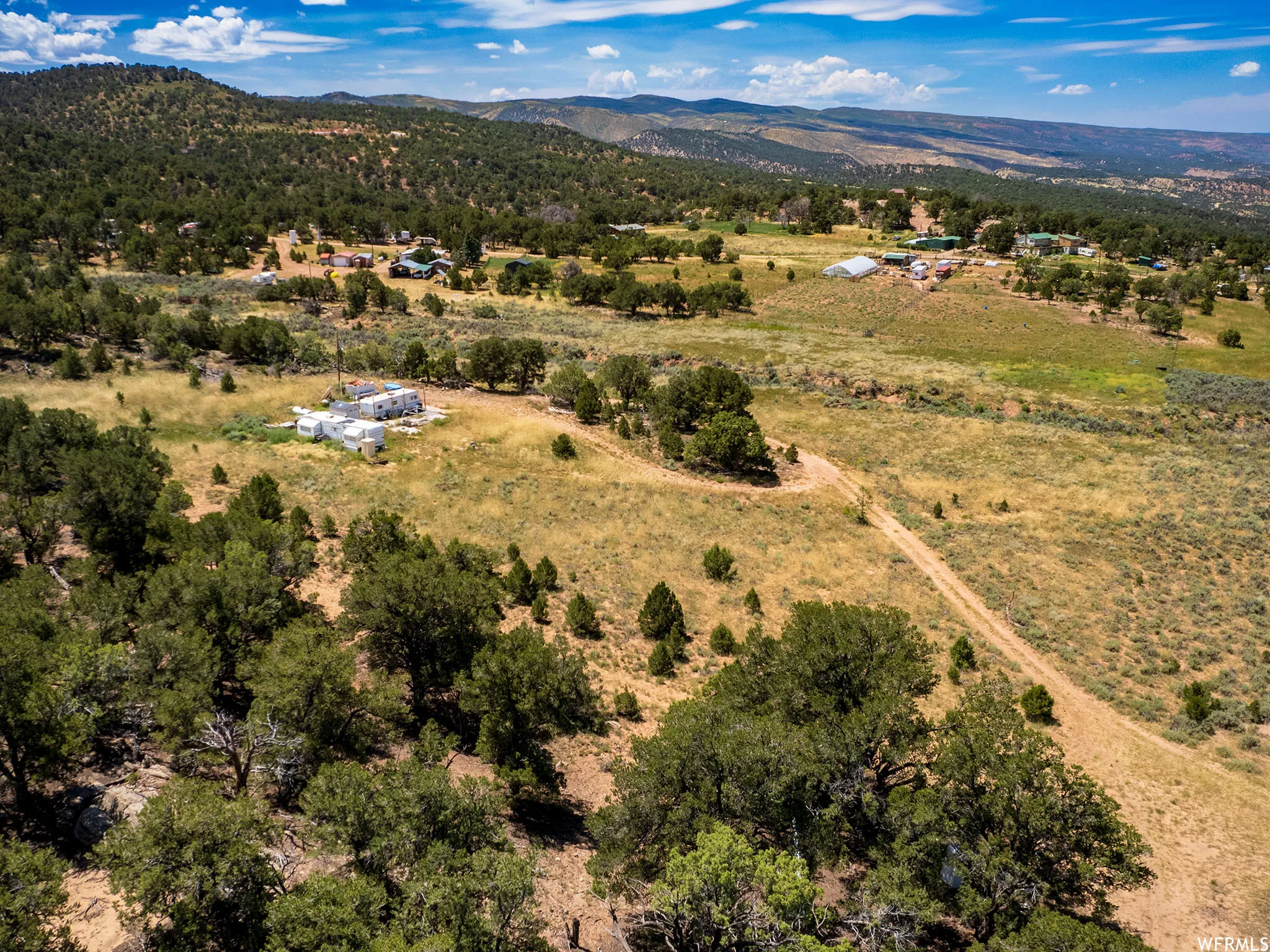 Aerial view of sparsely populated area featuring a mountain backdrop