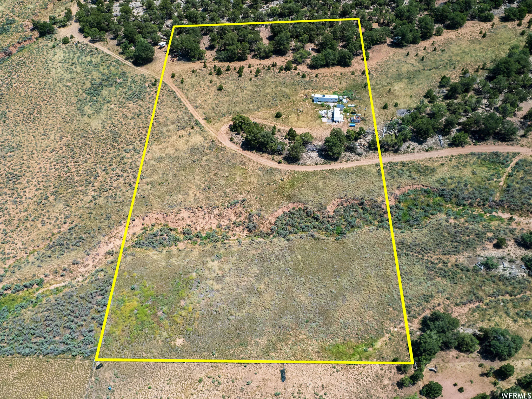Overview of rural landscape featuring property parcel outlined