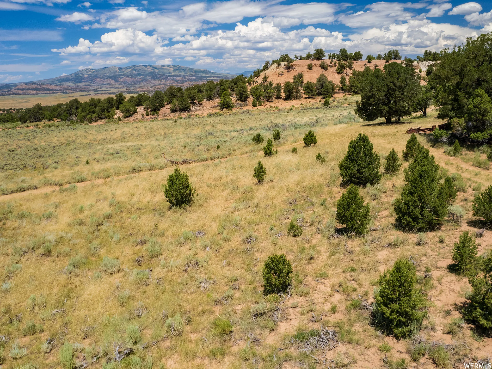View of mountain backdrop with rural landscape