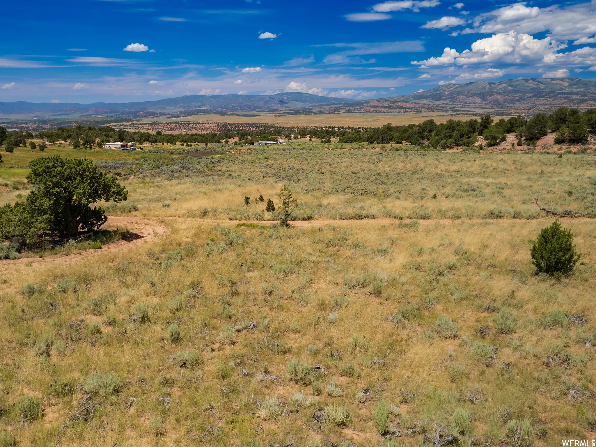 View of mountain backdrop with rural landscape