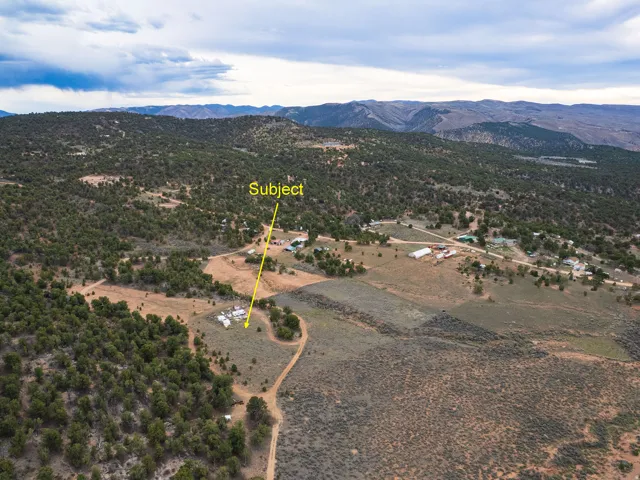 Overview of rural landscape featuring a mountain backdrop