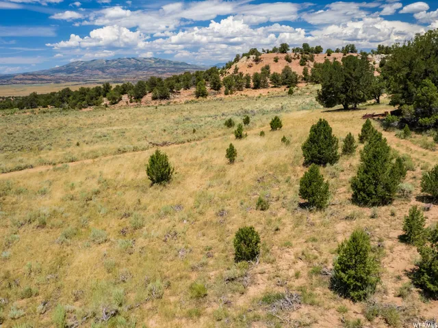 View of mountain backdrop with rural landscape