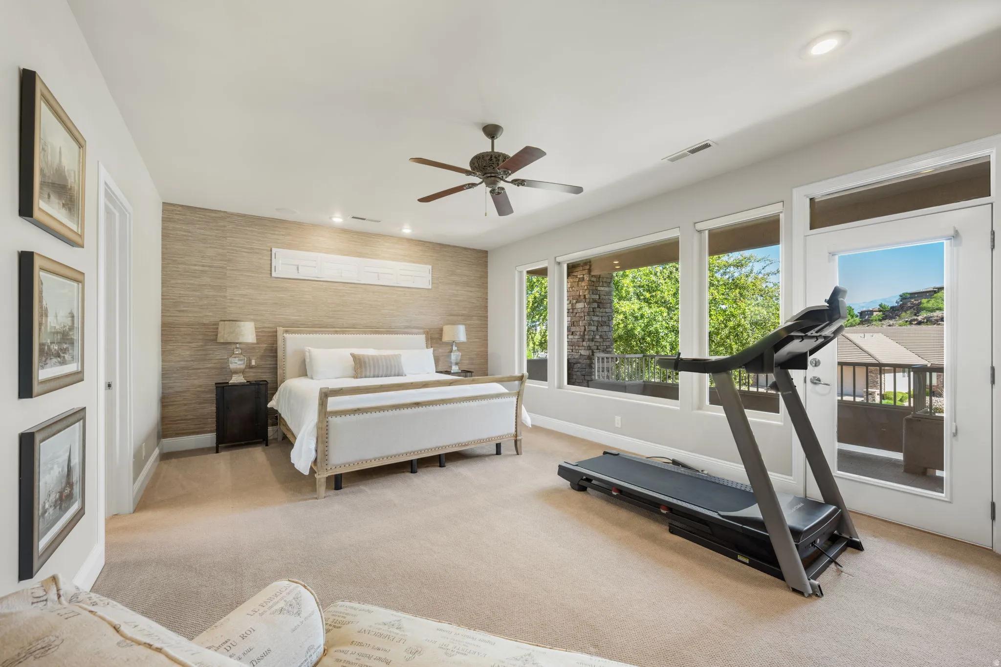Bedroom featuring access to outside, light carpet, recessed lighting, an accent wall, and ceiling fan