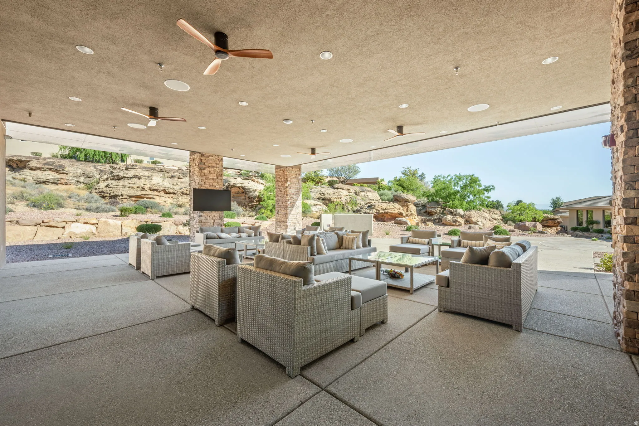 View of patio featuring an outdoor living space and a ceiling fan