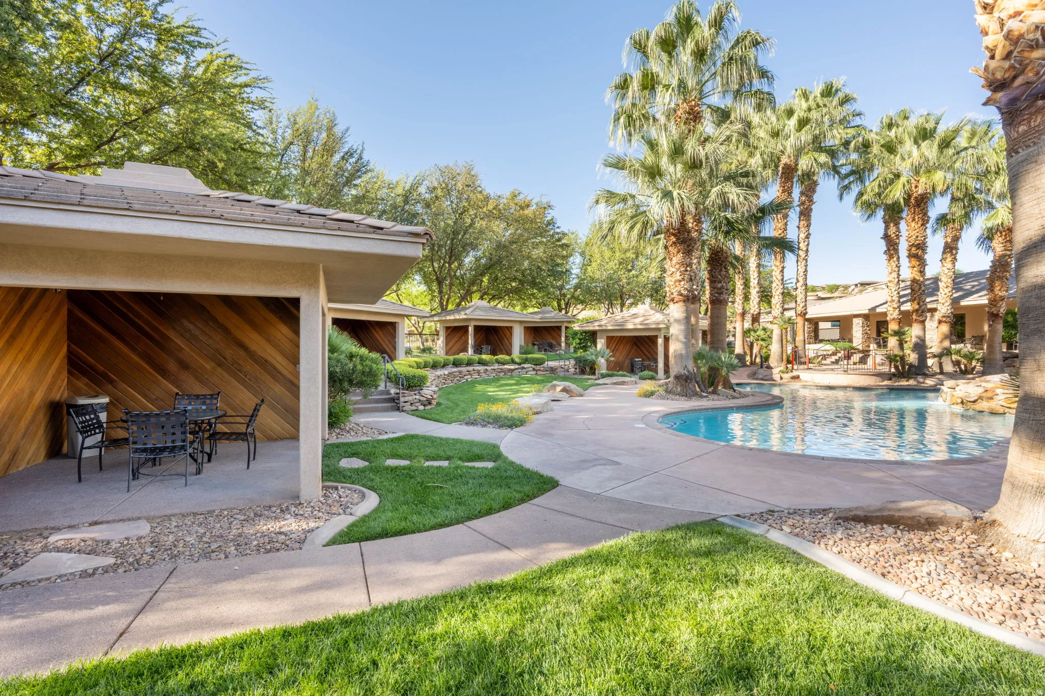 Outdoor pool featuring a patio, a yard, and outdoor dining area