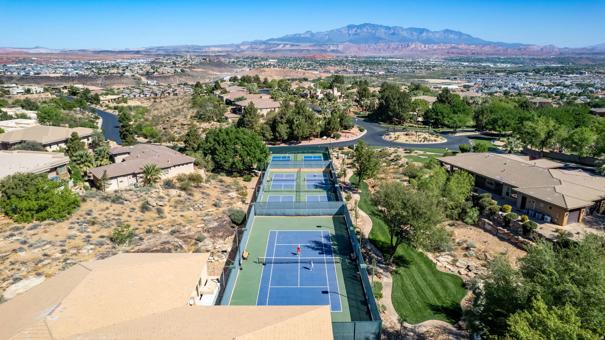 Aerial view of residential area featuring mountains