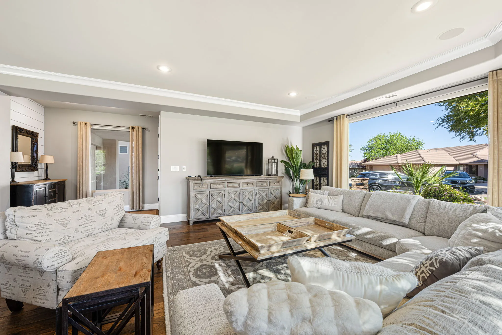 Living room featuring dark wood-type flooring and recessed lighting