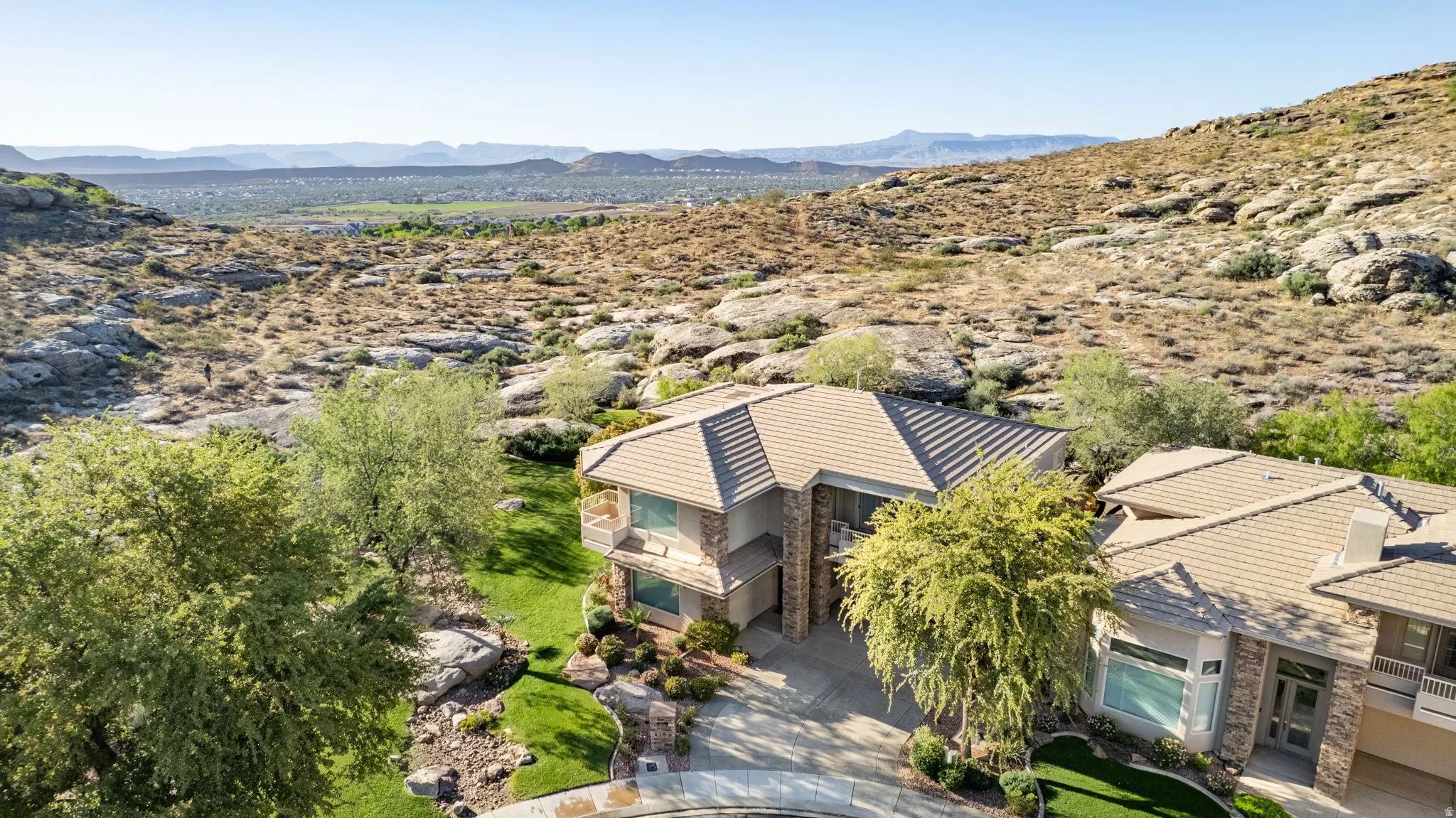 View from above of property featuring a mountainous background