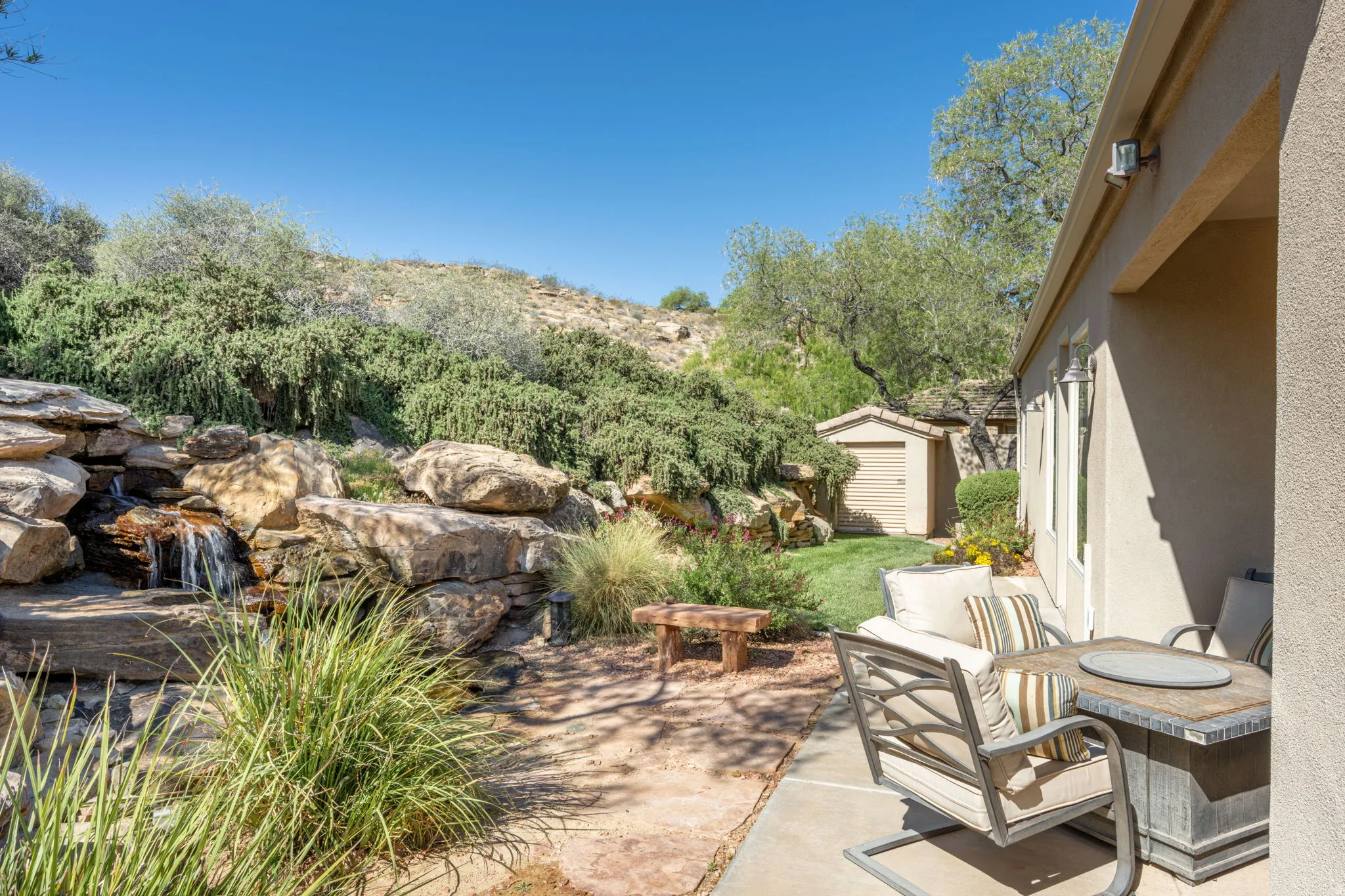View of patio with a shed